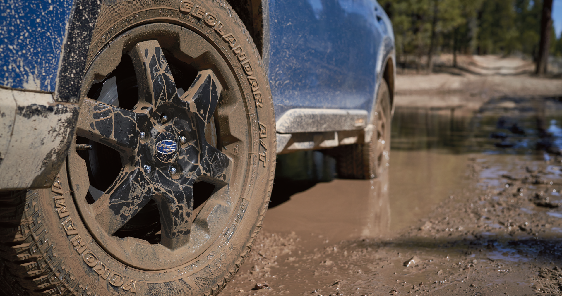 A close-up of the 17-inch off-road wheels and all-terrain Yokohama GEOLANDAR® tires on the 2023 Outback Wilderness. | Dyer Subaru in Vero Beach FL