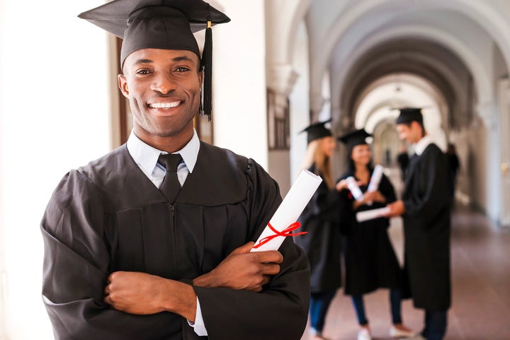 college graduate holding his diploma | Dyer Subaru in Vero Beach FL